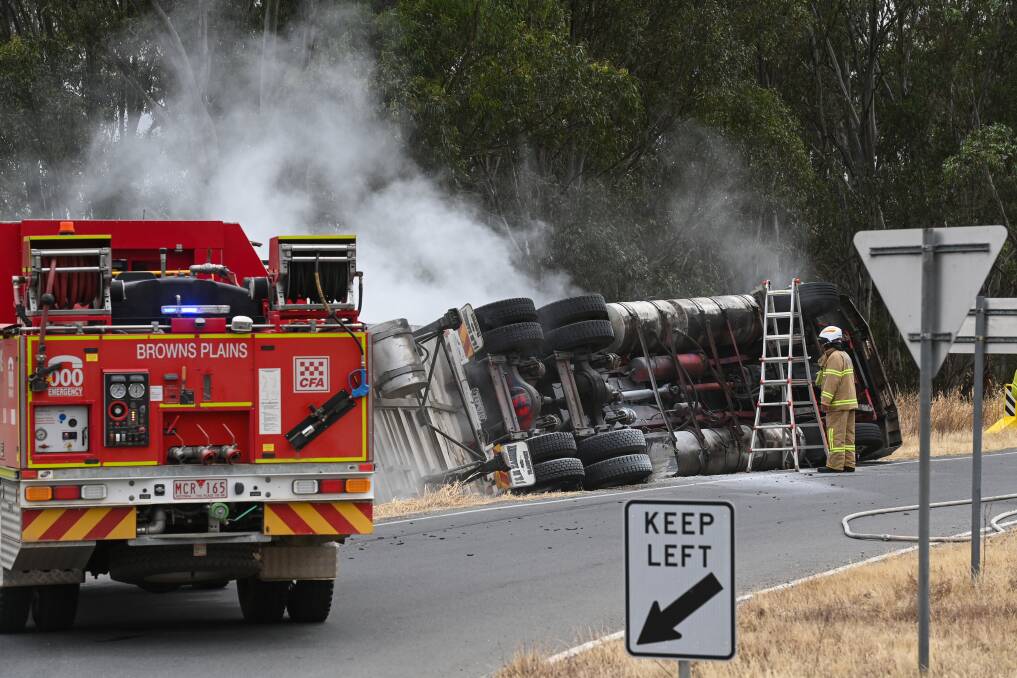 Emergency services were called to Browns Plains after a semi-trailer rolled onto its side. Picture by Mark Jesser