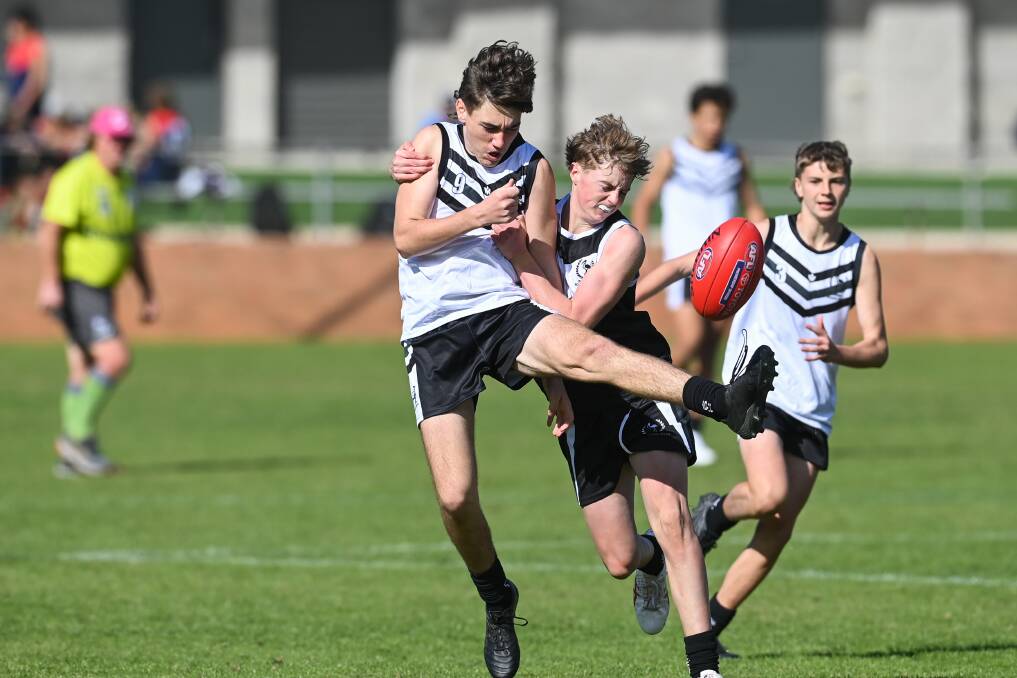 Riverina Murray's Jayden McGrath is tackled by Mason Crawford-Foster. Picture by Mark Jesser