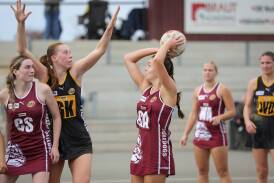 Wodonga's Lily McKimmie lines-up her shot in her 19-goal performance for the Bulldogs against the Tigers at Martin Park on Saturday. Picture by James Wiltshire.