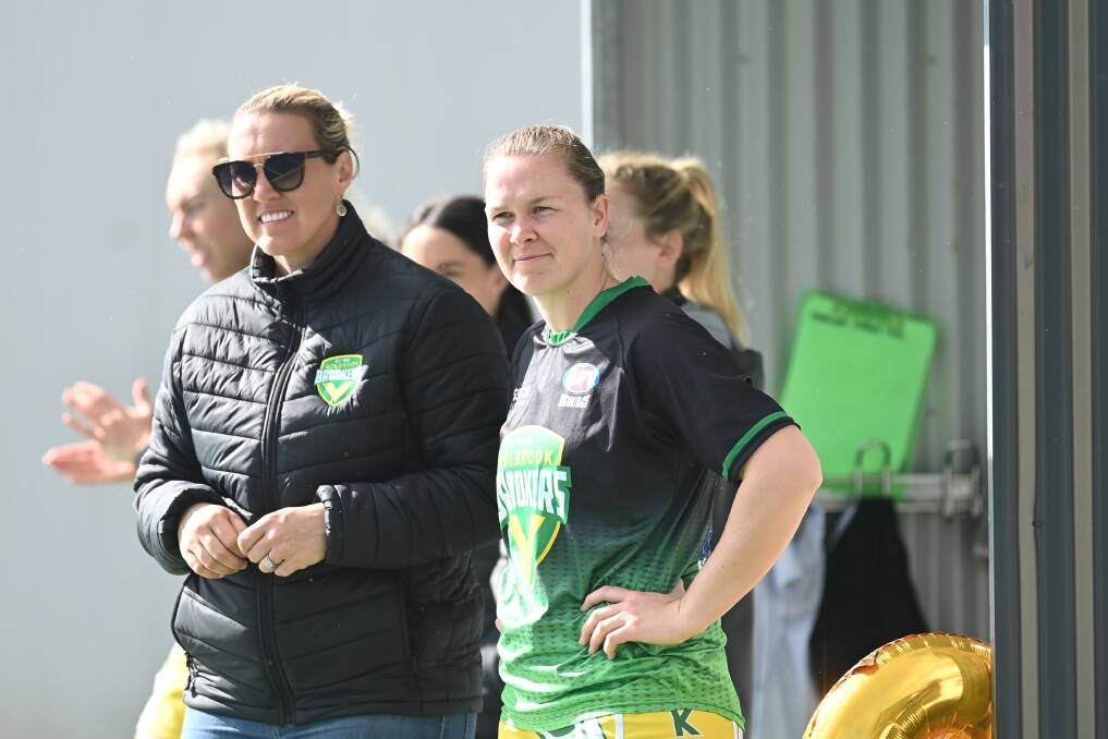 Holbrook A-grade coach Amy Platt (right) alongside club netball president Kelly Boers.