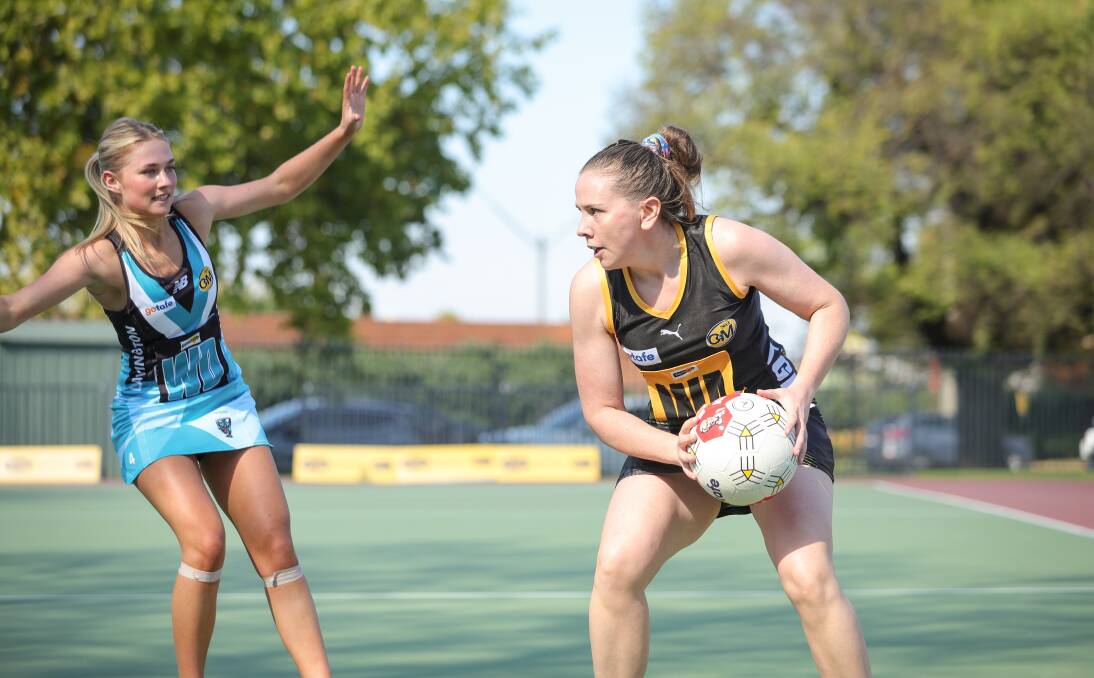 Panther Tamir Richardson defends Tigers' captain Justine Willis during the club's clash at Albury on Saturday. Picture by James Wiltshire
