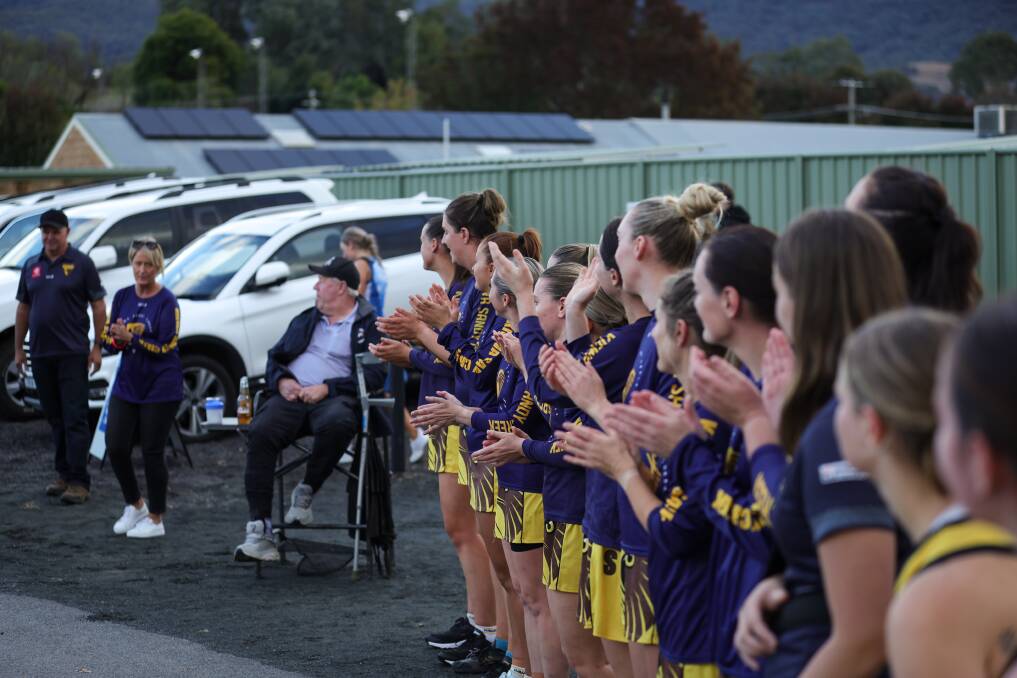 Kiewa-Sandy Creek's A-grade side gathers to unveil the side's 2023 flag during their home clash against the Roos. Picture by James Wiltshire.