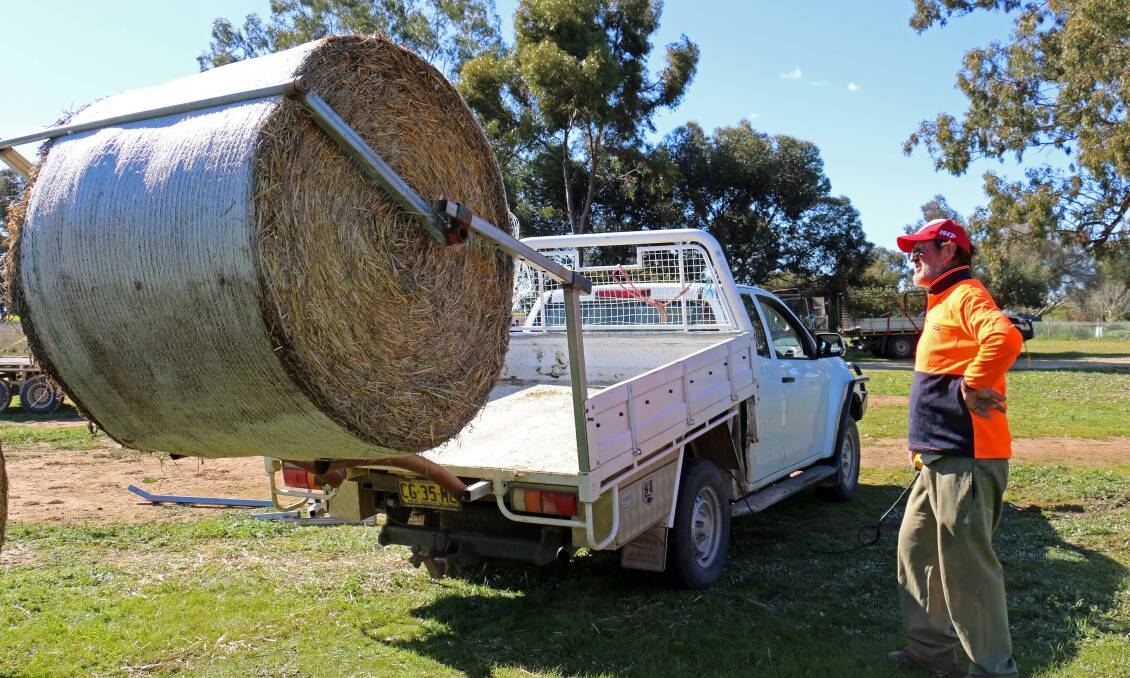 TAKE A LOAD OFF: Daysdale farmer and Henty Agri-innovator Award nominee Peter Mills has invented a ute bale lifter which can be operated remotely.
