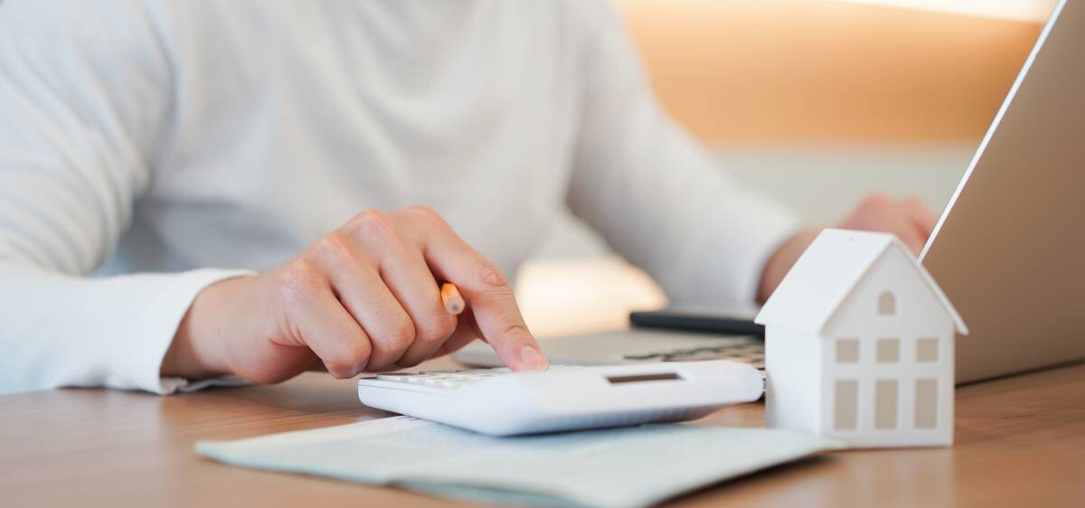 ADDING UP: Now might be the perfect time to take a close look at your current home loan. With loans offering more features and record low interest rates, you may be able to start saving. Picture: Shutterstock