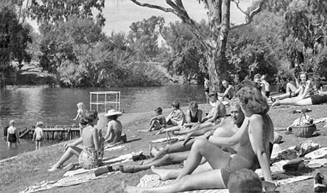 TRADITION: Locals on the bank of the Murray River at Noreuil Park in the 1950s. The park has stood the test of time and is still a popular spot to chill thanks to constant improvements and updates to facilities.