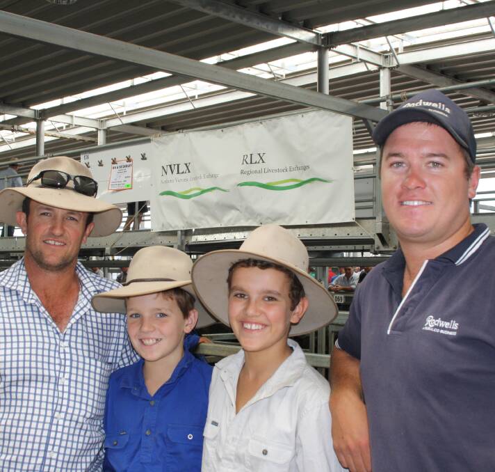 ALL SMILES: Bill, Harry and Charlie Dudley, of Cornalla East, Deniliquin, with agent Justin Barker, of Rodwells.