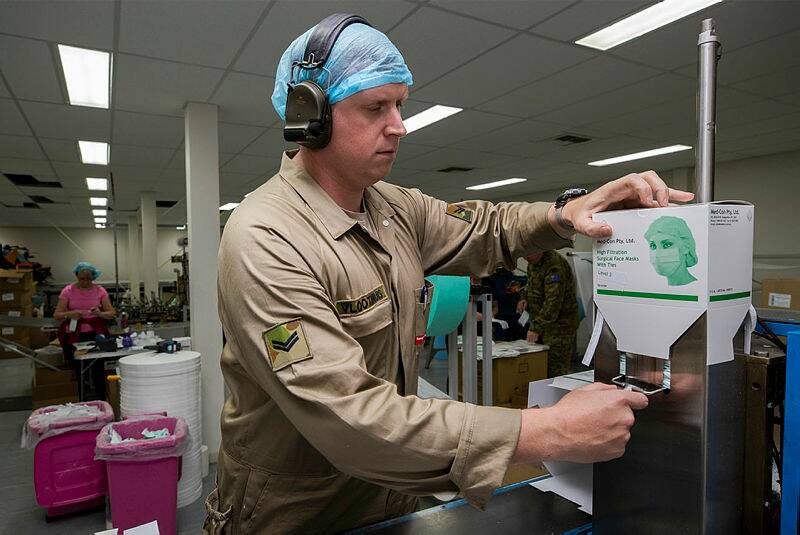 HELPING HAND: The need for masks was so desperate, the Department of Defence was called in to provide labour at Med-Con's manufacturing warehouse.