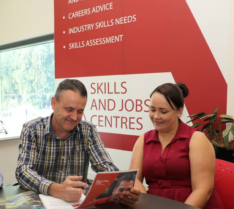 Skills and Jobs Centre advisor Scott O'Brien chats to apprenticeship support officer Cara Ross at the Wodonga Skills and Jobs Centre, which is now fully operational. 