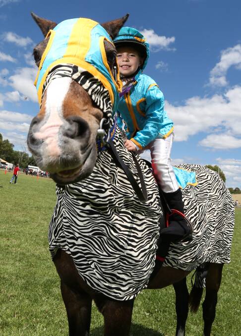 NEIGHHH: Lillianna Meyer-Vale, 6, from Berrigan, on her horse Tiffany at the Holbrook Show, wearing the colours from the movie Racing Stripes. Picture: JAMES WILTSHIRE