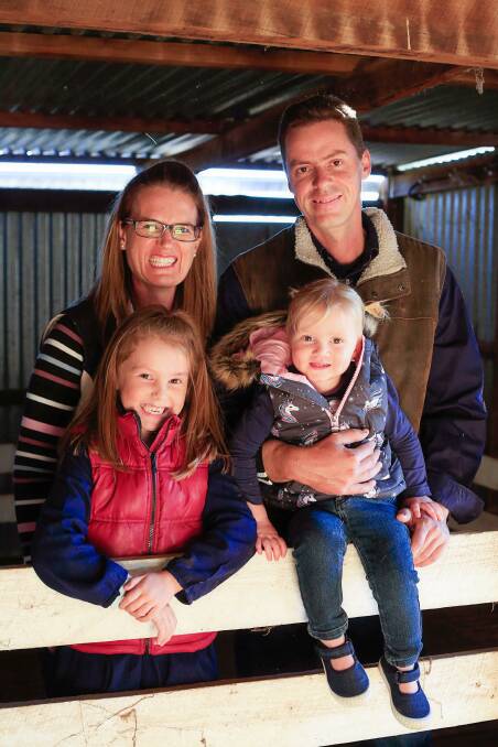 Carla and Justin Dillon with their daughters Savannah and Madeline. The family are currently separated as Justin runs the family farm in North Star, while Carla and the girls remain at home in Goondiwindi. Photo: Hannah McNulty, Dalli Cottage Photography