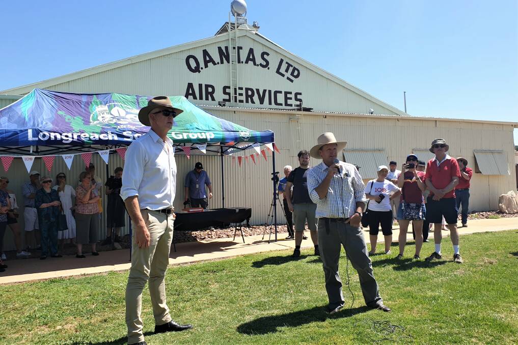 At the centenary of Qantas at Longreach were Qantas Founders Museum CEO Tony Martin, and director and great nephew of Hudson Fysh, local grazier David Fysh. The heritage listed hangar in the background is where company aeroplanes were made and repaired in the airline's early days.