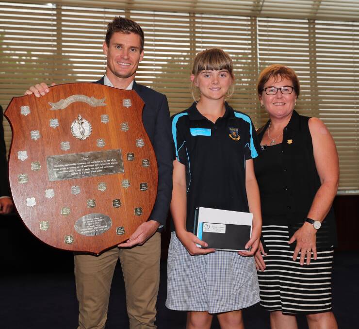 TOP TALENT: Deniliquin's Elena Mulham is presented the Bernie O’Connor Award by Brad Kahlefeldt and Corowa's Debbie Filliponi in Wagga on Friday. Picture: Les Smith