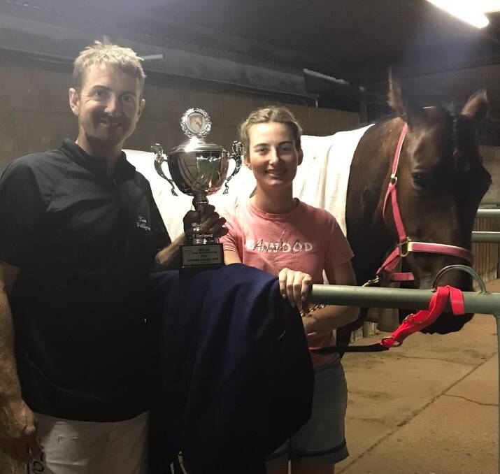 CUP SUCCESS: Tom Gilligan, Brooke McPherson and Rusty Crackers with the Temora Pacers Cup they combined to win on Saturday night.