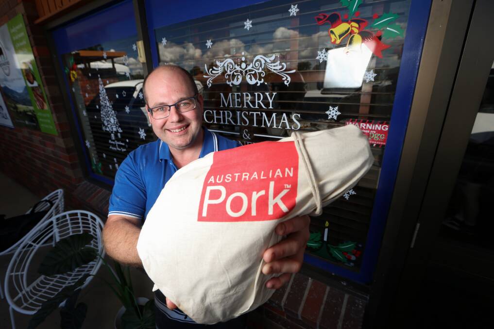 FAVOURITE HAM: Meat Talk Butchers co-owner Wade Thompson with his ham on the bone made in store. Picture: JAMES WILTSHIRE
