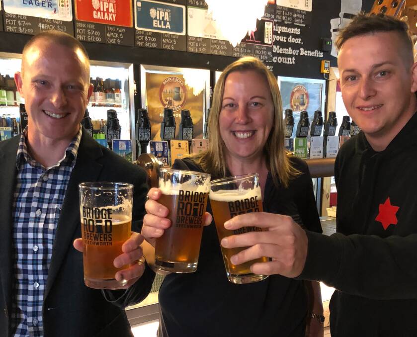 HERE'S CHEERS: Bridge Road Brewers chief executive Donald Mace, Trust Fund manager Kristy McMahon and Beer Deluxe Albury venue manager Bart Furst. 