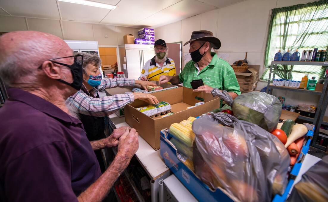TEAM WORK: Corryong FoodShare Services volunteers Gary Wilson, Jan Hastings, Geoff Bennett and Dave Castello - among many others including Carol and Douglas Allen - have been flat chat providing emergency food relief since the summer bushfire crisis. Pictures: MARK JESSER