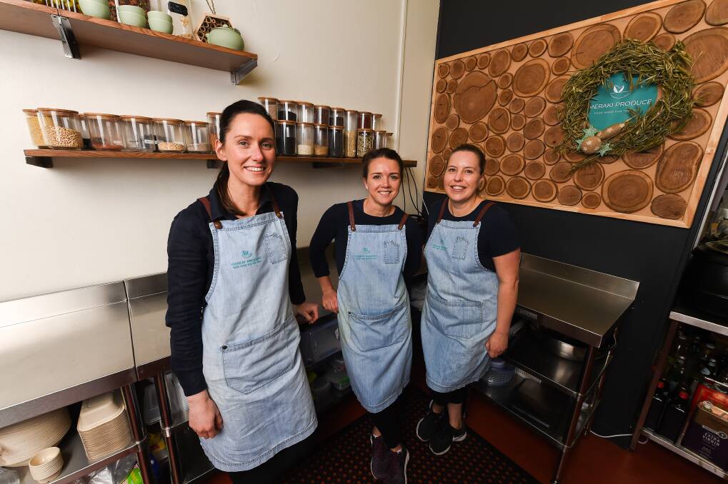 SOUL FOOD: Jacquie O'Donoghue, pastry chef Heidi Collins and chef Lindy Adams work in the Meraki Produce kitchen in Albury CBD, making about 30 different dishes in their wholesome grab and go range. Picture: MARK JESSER