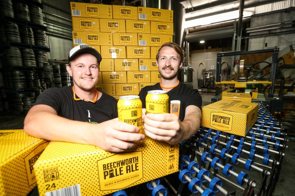 TOP DROP: Corey Voigt and Kane Niklaus with Bridge Road Brewers Pale Ale, which was voted sixth best in a nationwide craft beer poll held at the weekend. The beer has made the top 20 since 2013. Picture: JAMES WILTSHIRE