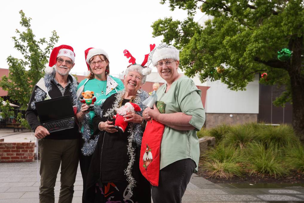 Albury Wodonga Repair Cafe volunteers Bruce Nulty, Allison Bowman, Lynne Keyes and Shelley Robotham get into the Christmas spirit ahead of the last session in 2023. Picture by James Wiltshire