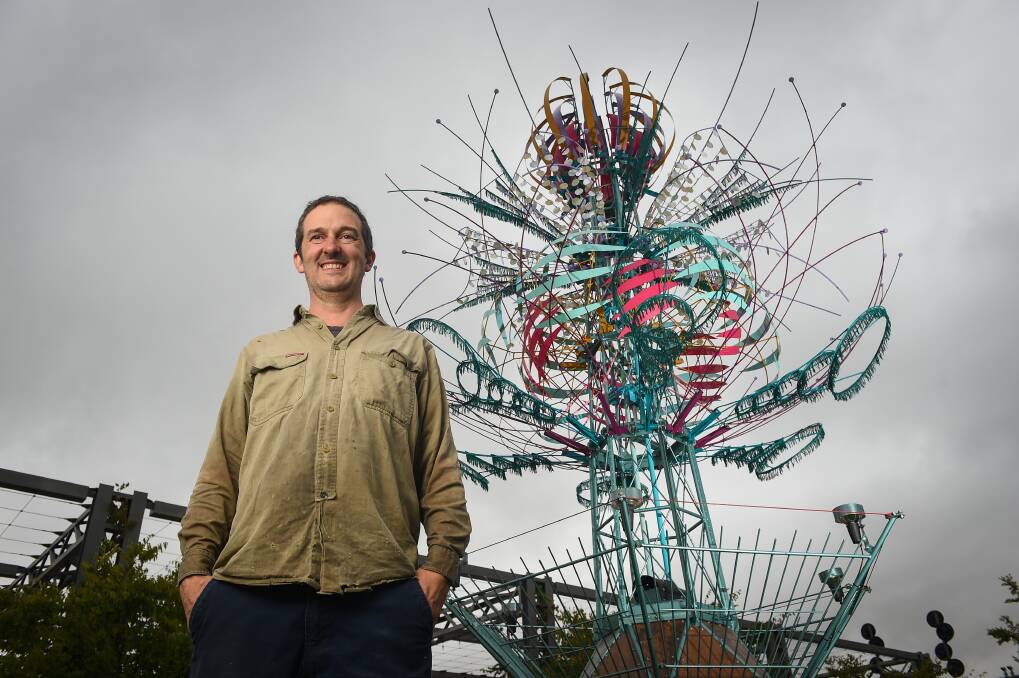 Alex Sanson with his "Spherophyte" in Junction Place in Wodonga for the new Upstream Festival of Art + Culture this weekend. Picture: MARK JESSER