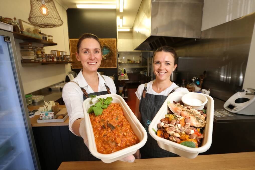 SPECIAL DELIVERIES: Meraki Produce's Jacquie Koschitzke and Heidi Collins make meals for delivery or takeaway. Picture: JAMES WILTSHIRE