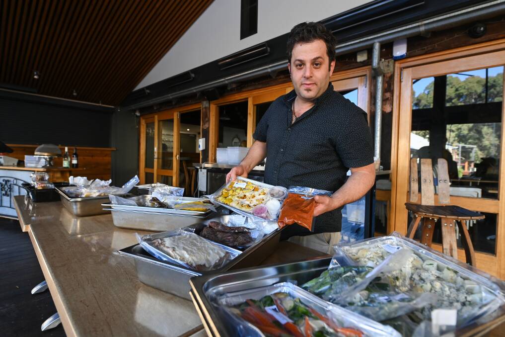 MARKET DAY: La Maison Restaurant owner Wassim Saliba offers pre-prepared chef's meals at a market day on Friday. Picture: MARK JESSER