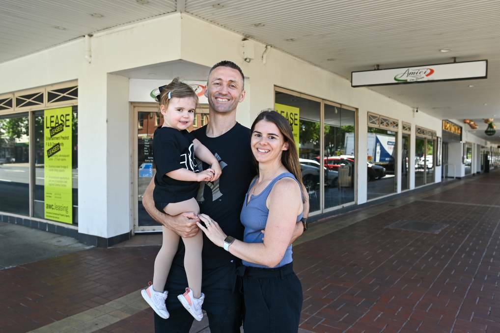 Grill'd Albury operators Kade and Carly Brown with their daughter Evie outside the shopfront, on the corner of Dean and David streets, in December. Picture: MARK JESSER