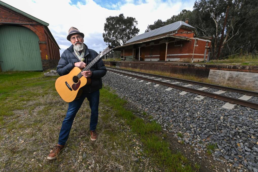 TRIBUTE SONG: Bethanga entertainer, author and teacher Peter Klein returns to Barnawartha Railway Station for the first time in 40 years to honour railway men Mark Wilson, 18, and George Sandford, 49. Picture: MARK JESSER