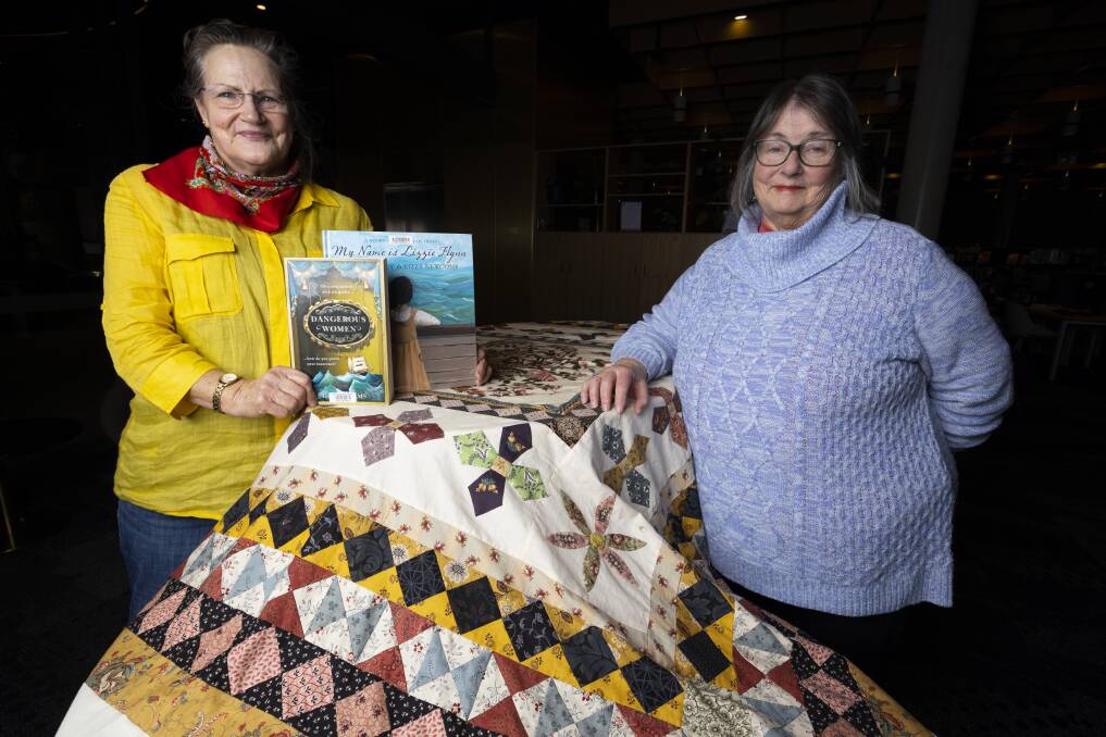 TEXTILE TRIBUTE: Wodonga Family History Society (WFHS) research officer Alice Lindsay and Wodonga quilter Leah Whale display the latter's tribute to the historic Rajah Quilt at the WFHS Library within Hyphen. Picture: ASH SMITH