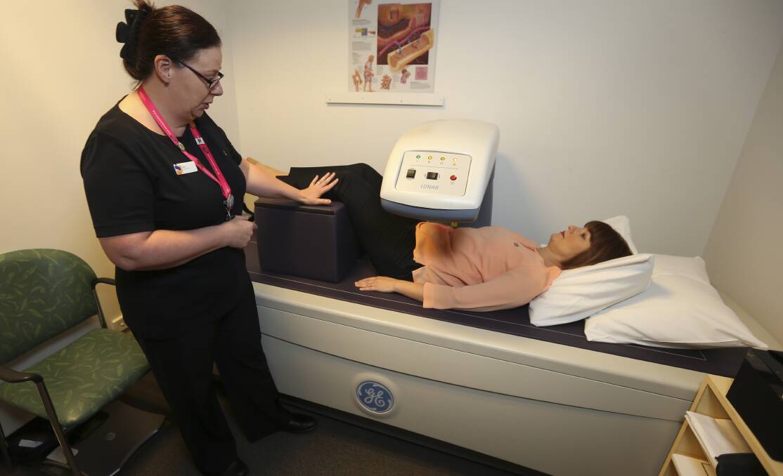 SIMPLE SCAN: Senior radiographer Sue Gibbins demonstrates on Heather Paterson one of three scans used to quantify bone density and map bone health.