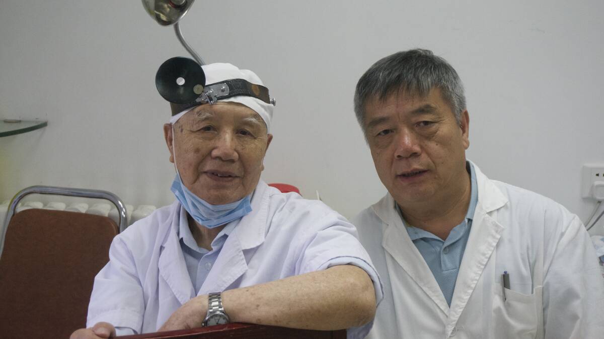 WORLD CLASS: Chinese ear, nose and throat surgeon Professor Xinwu Li, now aged in his 90s, continues to perform surgery one day a week despite "retiring" in the mid-1970s. This year Wodonga Chinese Medicine Clinic's Dr James Liu undertook training on an acupuncture point developed by Professor Li in the 1970s to treat the rising incidence of hay fever and sinusitis in modern China.