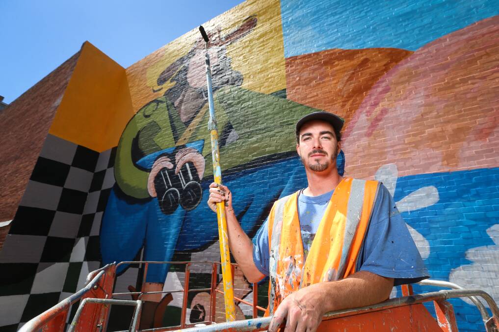 WALL ART: Chris Henderson works on his biggest mural yet, Little Egret, in Volt Lane, Albury CBD. Picture: JAMES WILTSHIRE