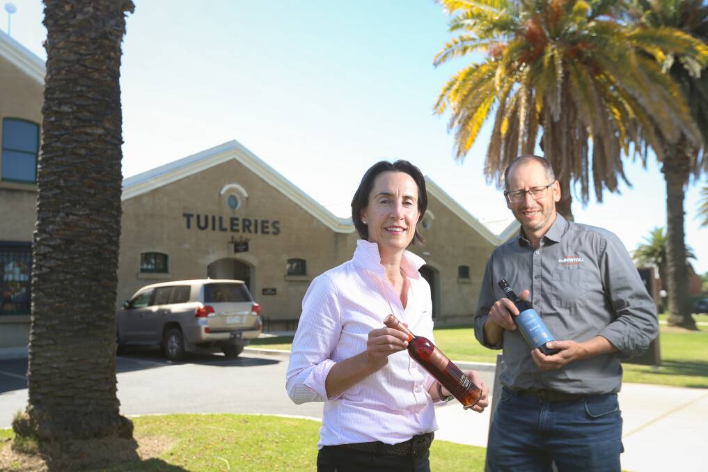 WORLD STAGE: Jane Campbell (Campbells Wines) and Marc Scalzo (De Bortoli Wines) celebrate their success with Rutherglen Muscat and 2018 Rutherglen Estate Durif, respectively, in the International Wine and Spirit Competition. Picture: JAMES WILTSHIRE