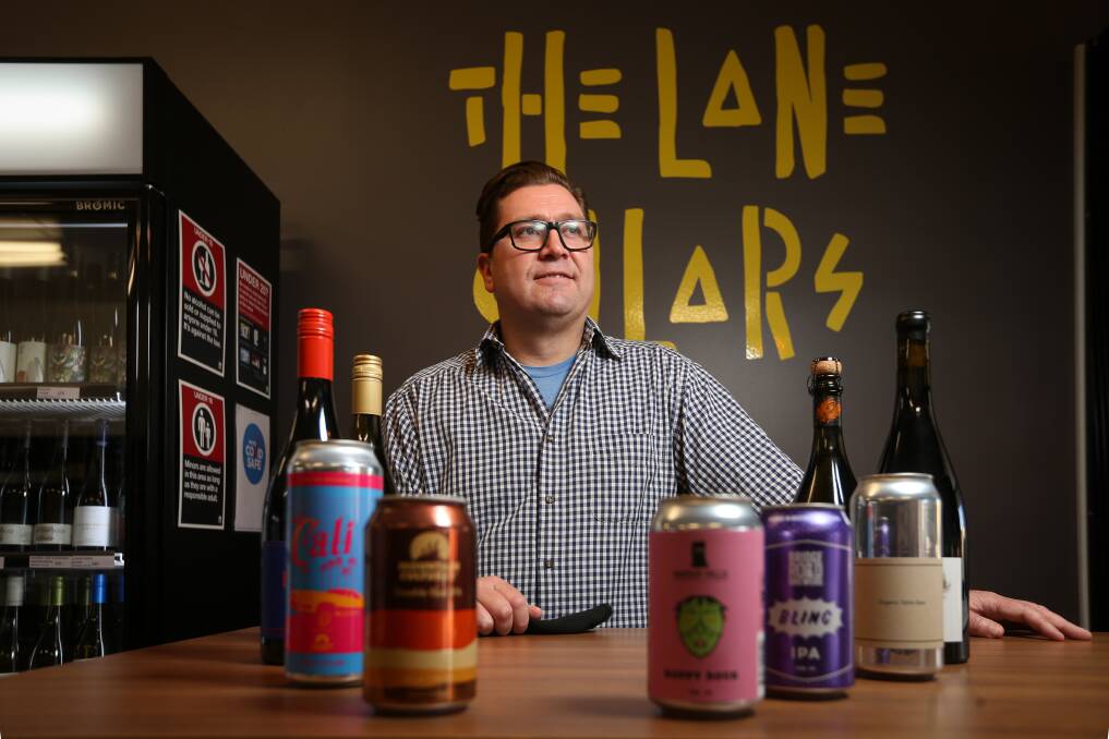 HERE'S CHEERS: The Lane Cellars Albury store manager Chris Brown is already buoyed by the public feedback. Picture: JAMES WILTSHIRE