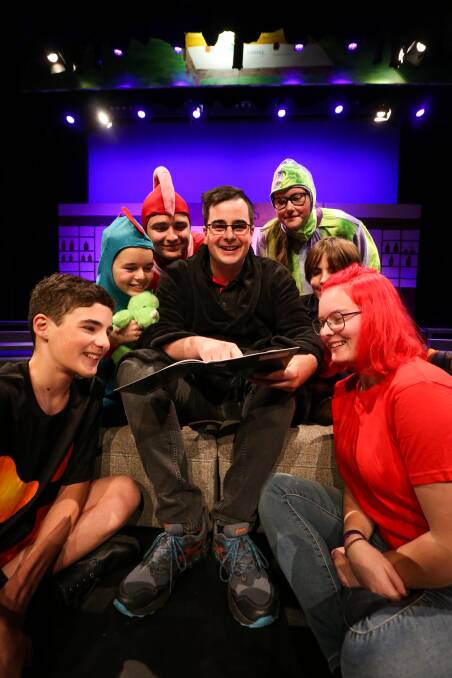STORY TIME: Albury Gang Show's Harley Maclachlan is surrounded by Rory Baines, 13, Sophie Lawrence, 14, Darby Seymour, 15, Caitlin Amos, 15, Jimmy Sides, 13, and Orla de Young for a rehearsal at Albury Entertainment Centre. Picture: JAMES WILTSHIRE