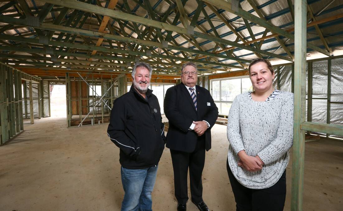 ON TRACK: Trevor Pearce, Freemasons Foundation's Neville Wiggins and Belvoir Special School vice principal Ebony Mitchell inspect progress. Picture: JAMES WILTSHIRE