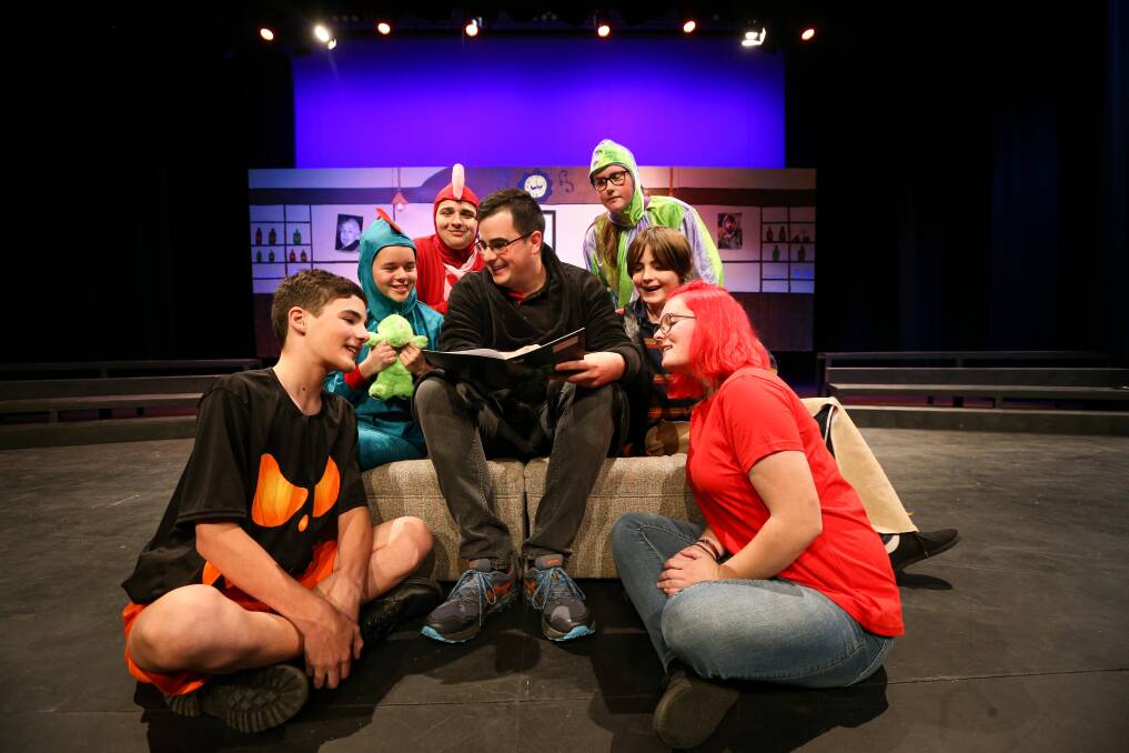 STORY TIME: Albury Gang Show's Harley Maclachlan is surrounded by Rory Baines, 13, Sophie Lawrence, 14, Darby Seymour, 15, Caitlin Amos, 15, Jimmy Sides, 13, and Orla de Young for a rehearsal at Albury Entertainment Centre. Picture: JAMES WILTSHIRE