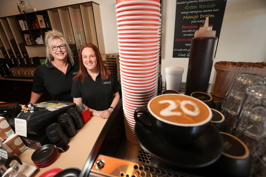 Coffee Mamma owners Kerry Golding and Helen McFarlane celebrate the iconic espresso bar's 20th birthday in Albury today. Picture by James Wiltshire