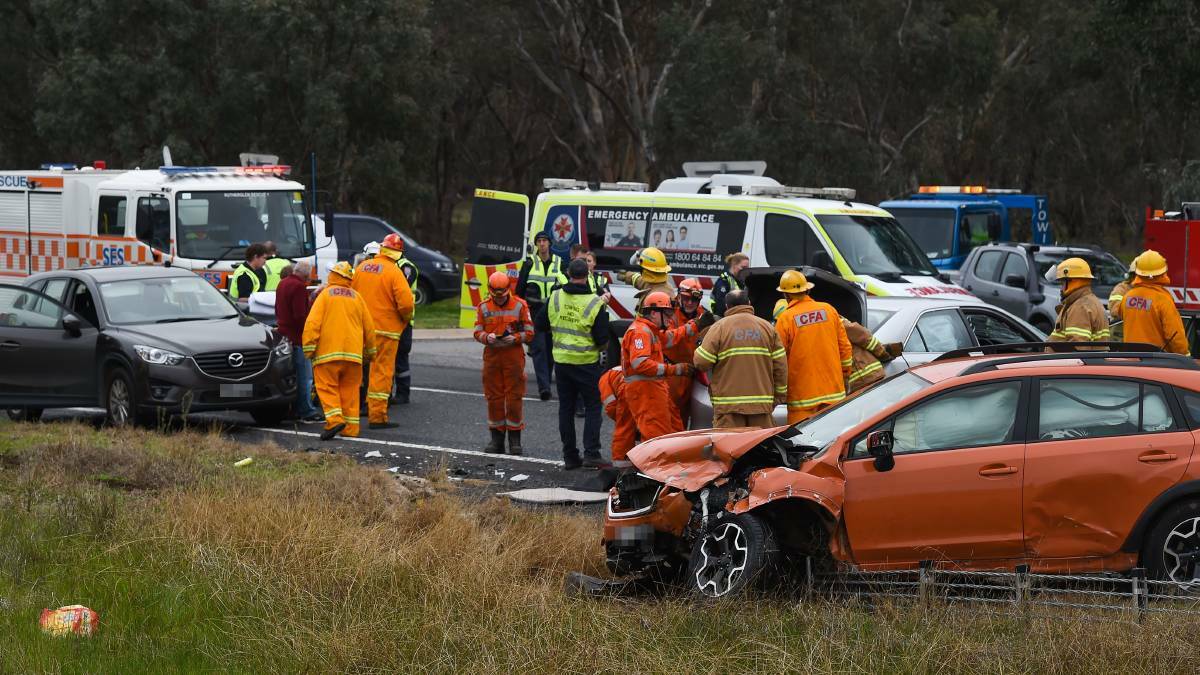 CRASH SCENE: Police, SES and CFA attend the two-car crash south of Chiltern on Friday. Picture: MARK JESSER
