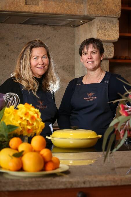 BEE PREPARED: Sally Lynch, of Taste Trekkers, and Beechworth Honey founder and fourth-generation beekeeper Jodie Goldsworthy prepare for the spring season of Bee School after renovations over winter. Picture: JAMES WILTSHIRE