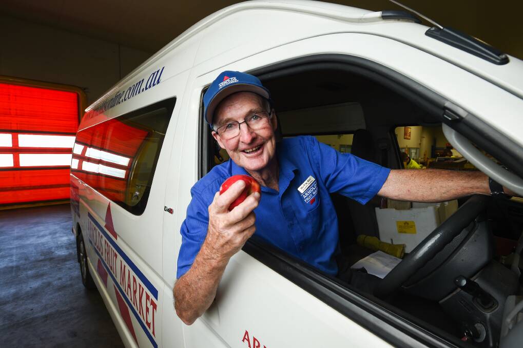 DRIVE TIME: Popular Arnold's Online driver Bill Mooney did his final shift delivering fruit and vegetable boxes around Albury and Wodonga yesterday afternoon, retiring from the post after 15 years. Picture: MARK JESSER