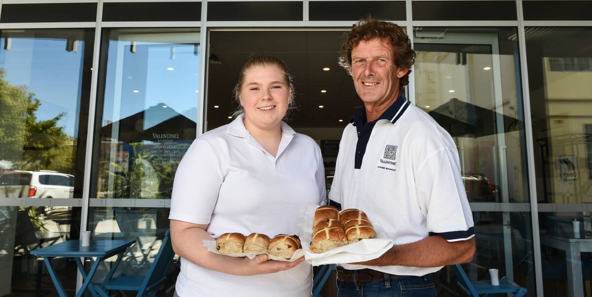 BAKED GOODS: Valentines Traditional Bakehouse apprentice baker Kaitlyn Duncan and owner and baker Ross Perry bake hot cross buns at the Rutherglen bakery daily to supply five outlets on the Border. Picture: MARK JESSER