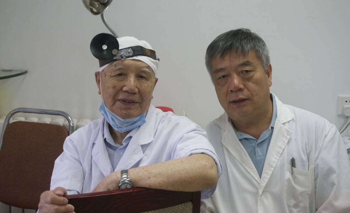 TEAM WORK: Chinese Medicine physician James Liu, right, studied the acupuncture point developed by Chinese ear, nose and throat surgeon Professor Xinwu Li.