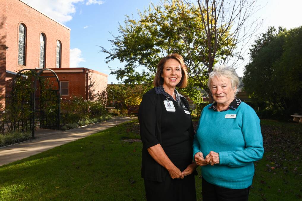 Mercy Health palliative care loss and grief support worker Michelle Enright and volunteer Anita Pickett in the established gardens at the Poole Street facility. Pictures: MARK JESSER