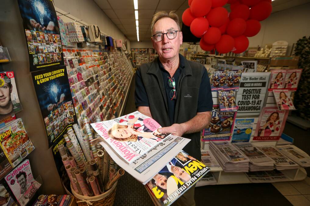 HOME READING: Albury Newsagency owner Bernard Harrison reminds people in his newspaper delivery area they can add magazines to their order. Picture: JAMES WILTSHIRE