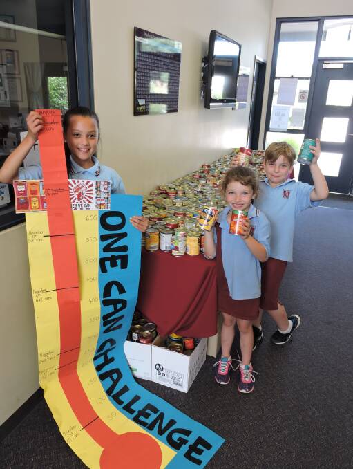 SURE CAN: Wodonga Primary School pupils Briana Grubisic, with the barometer, Maddison McLennan and Koen Barnes get behind the One Can Challenge.