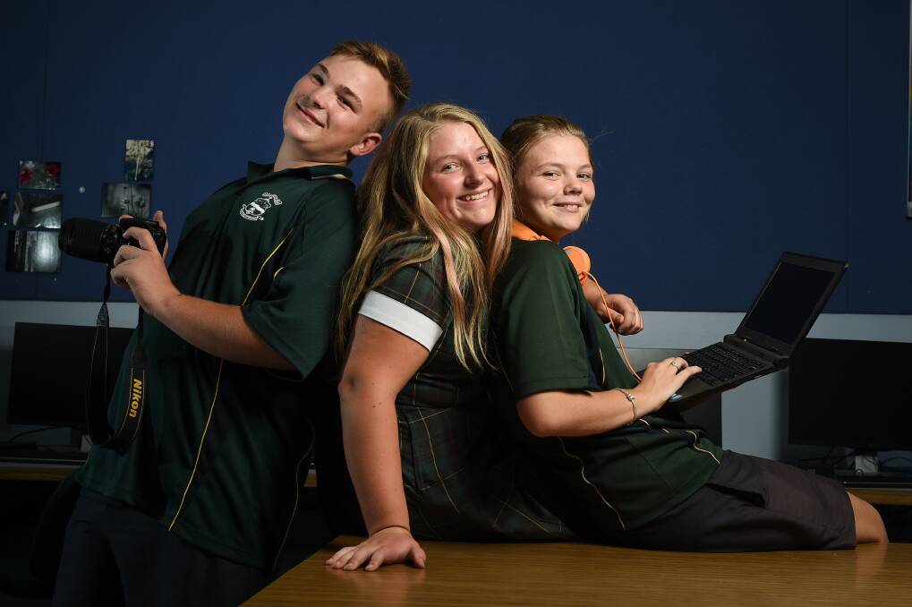 PLUGGED IN: Xavier High School students Jacob Tants, 14, Ellie Walsh, 14, and Ivy O'Halloran, 13, take advantage of the weekly Digital Incubator at lunchtime at the school to share skills and make connections. Picture: MARK JESSER