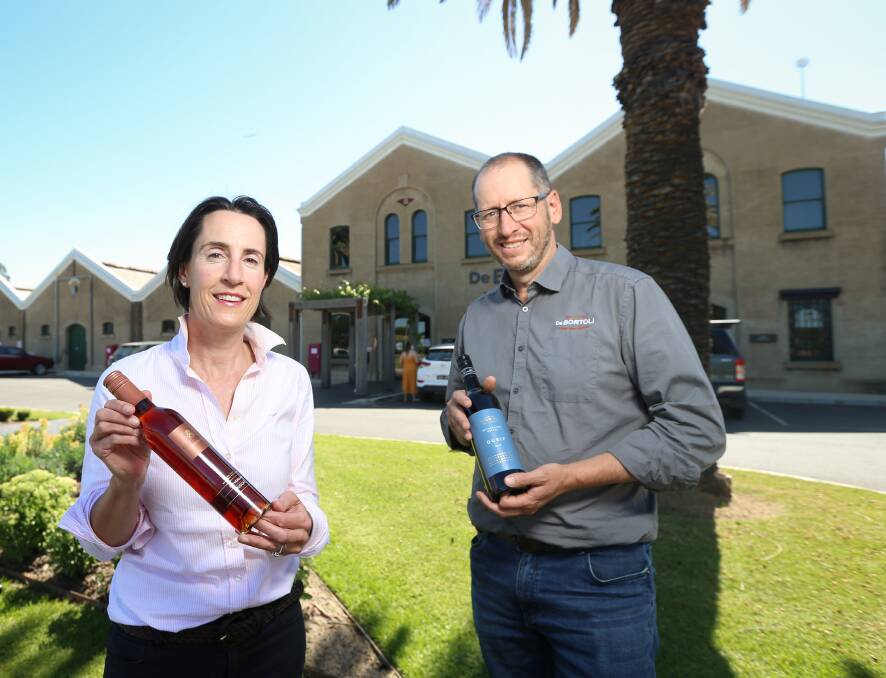 WORLD STAGE: Jane Campbell (Campbells Wines) and Marc Scalzo (De Bortoli Wines) celebrate their success with Rutherglen Muscat and 2018 Rutherglen Estate Durif, respectively, in the International Wine and Spirit Competition. Picture: JAMES WILTSHIRE