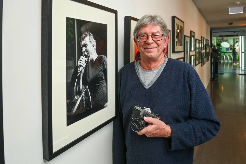 Wodonga photographer Paul Temple with the exhibition done in collaboration with Ian Hood. Picture by Mark Jesser