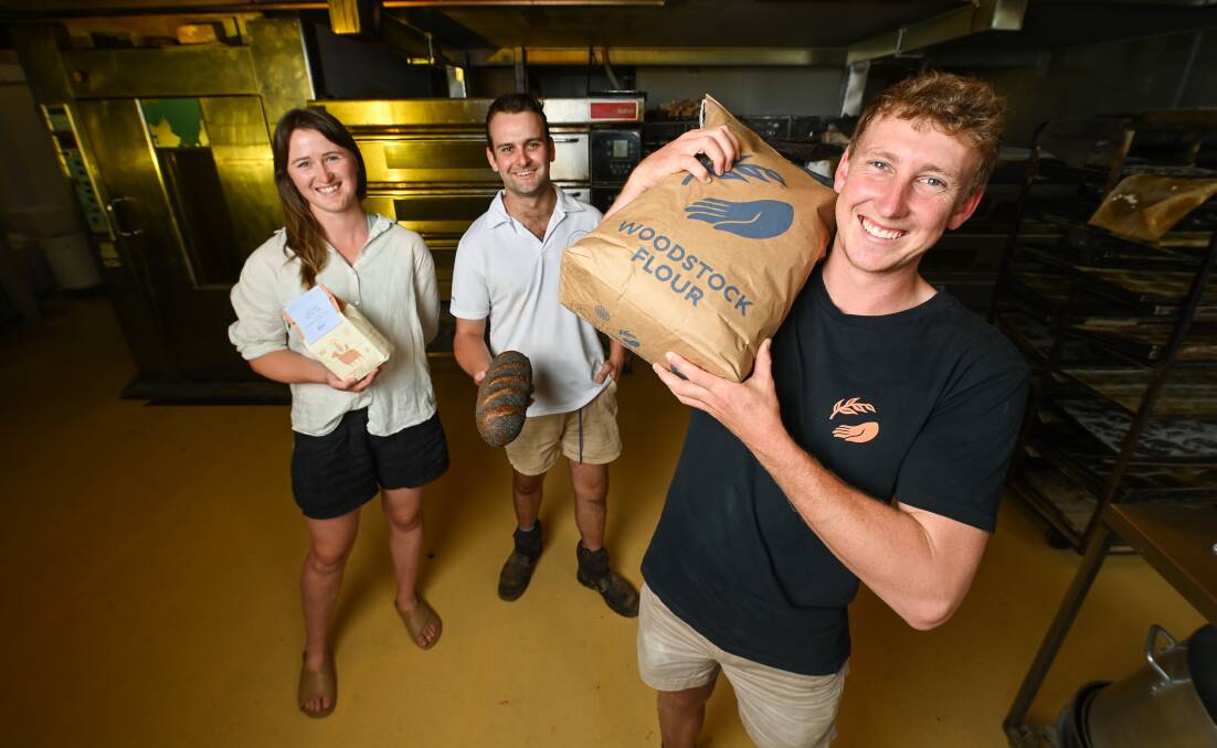 SUPPLY CHAIN: Valentines co-owner Joe Perry, centre, with Woodstock Flour operators Courtney Young and Ian Congdon. Picture: MARK JESSER